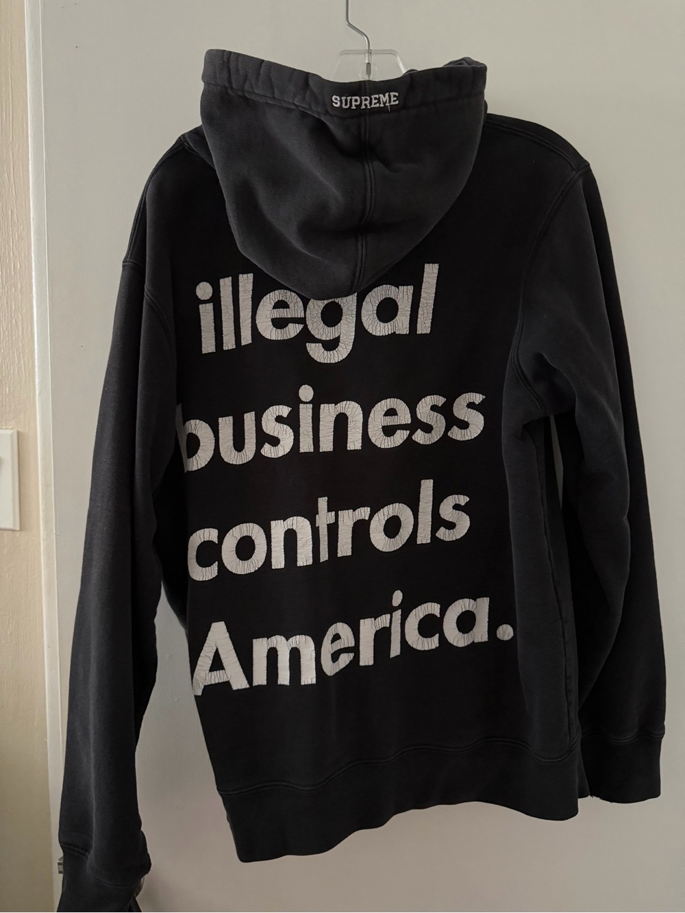 Supreme Black Hoodie with Red Logo Tag